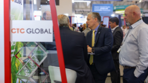 A group of people standing in a tradeshow booth